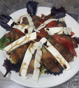 Fried Artichoke Hearts over a bed of baby greens with fresh mozzarella and tomato topped with balsamic glaze