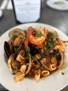 Lobster Fra Diavolo clams, mussels, shrimp, lobster tails, and calamari over linguini 