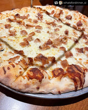 A pizza with cheese and chicken toppings, possibly part of a meal set like 'Mary Max Pizza'.