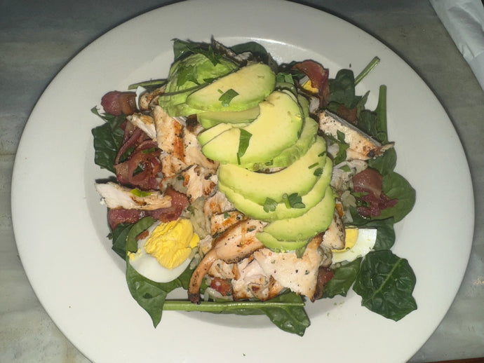 Chicken & Rice Bowl Grilled chicken, spinach, bacon, avocado & hard boiled eggs over cilantro lime rice.