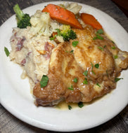 Pork Cutlet Francese with a side of mashed potato and vegetables