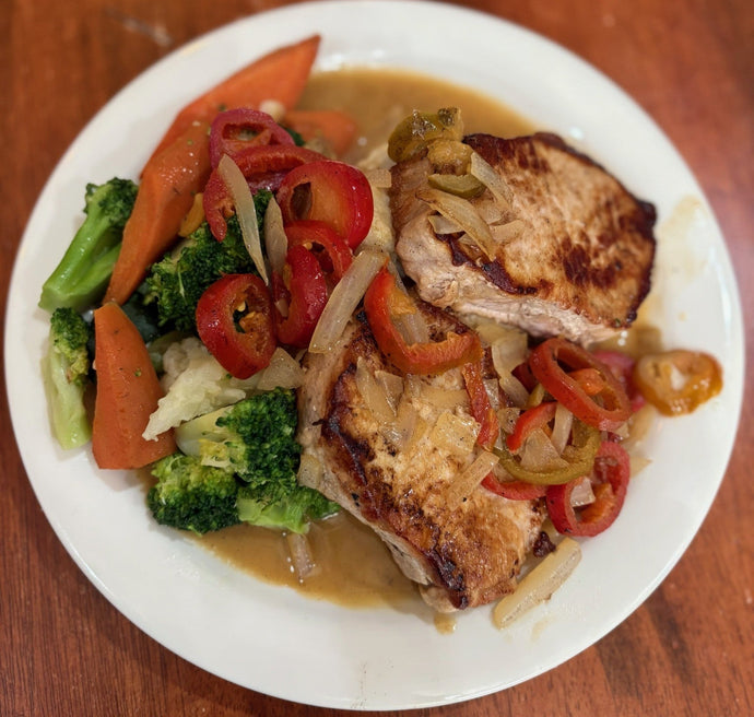 Pork Medallions Pan sautéed with cherry peppers & onions in a white wine sauce over mashed potatoes.