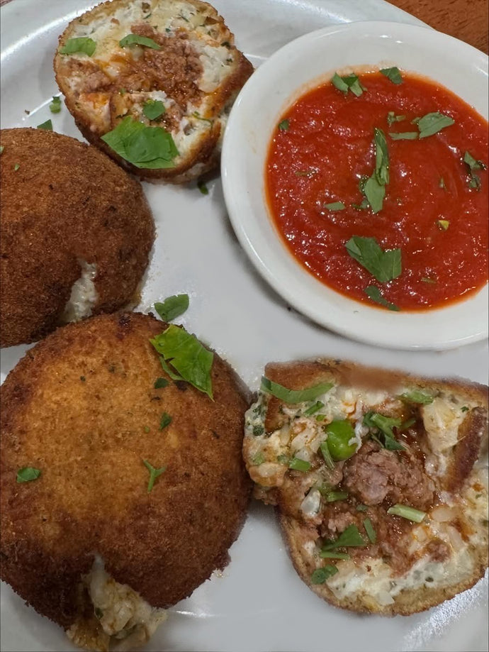 Sicilian Rice Balls fried rice balls Sicilian style, stuffed with meat sauce, peas and mozzarella.